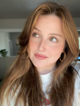 woman wearing a face mask and headphones influencer skincare